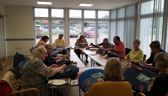 a group of craft workers in a meeting room